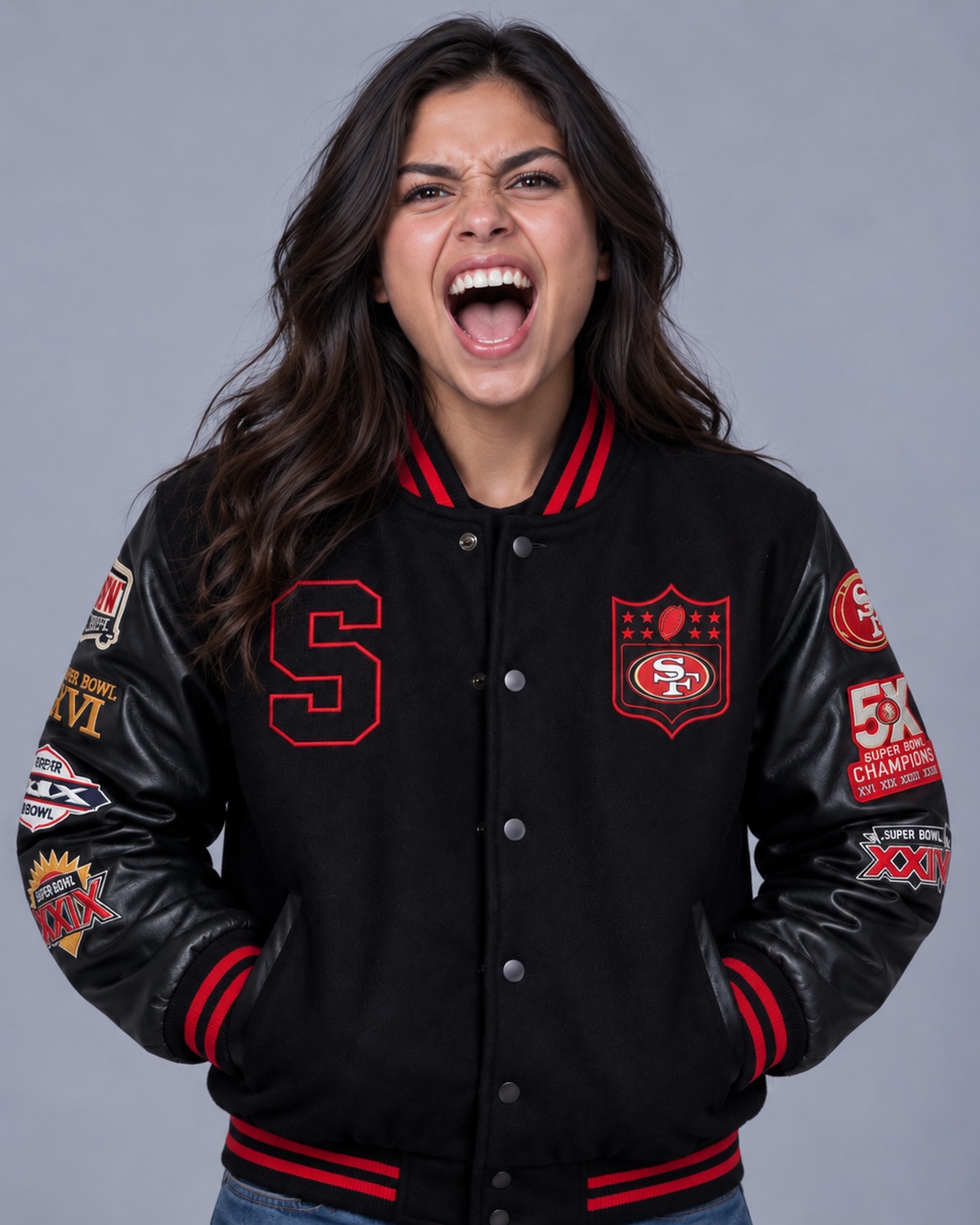 Woman cheering in a black and red wool varsity jacket